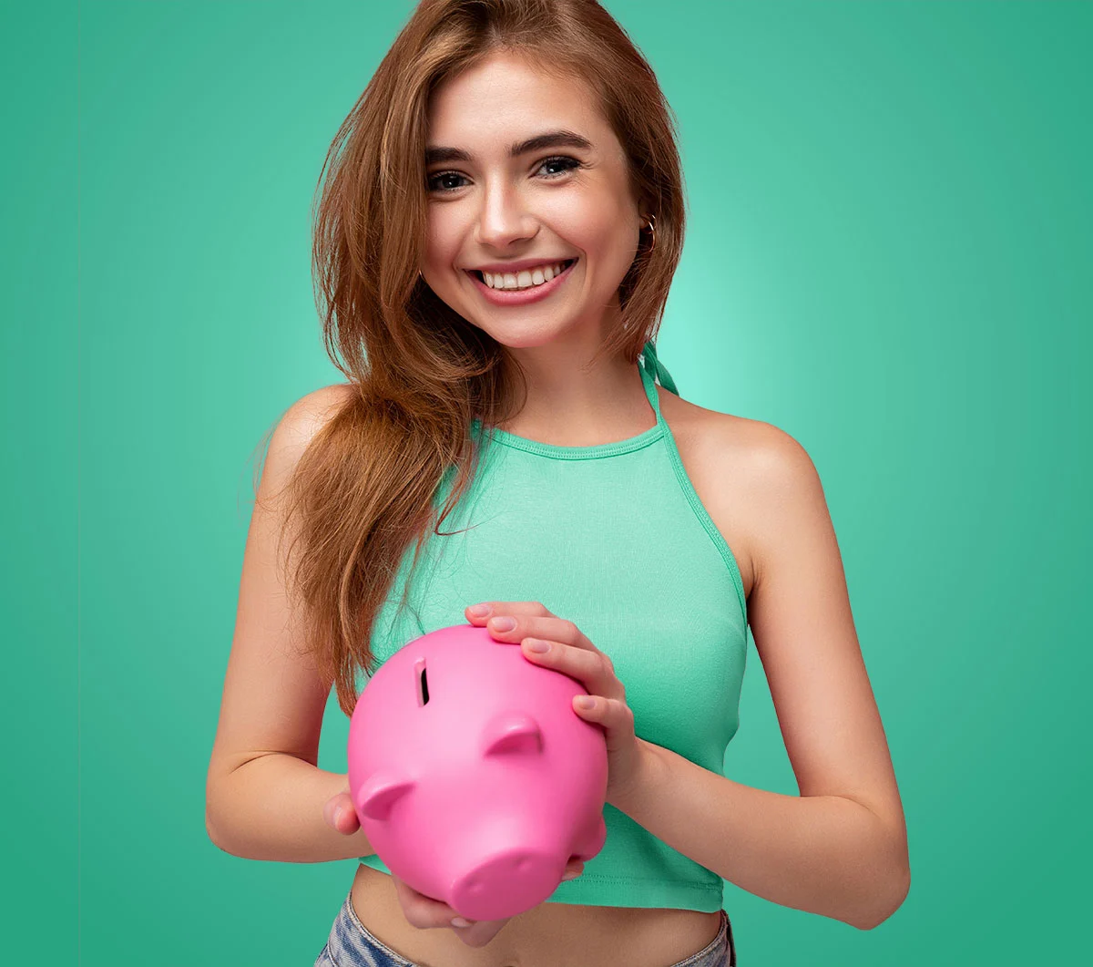 Young woman holding piggy bank